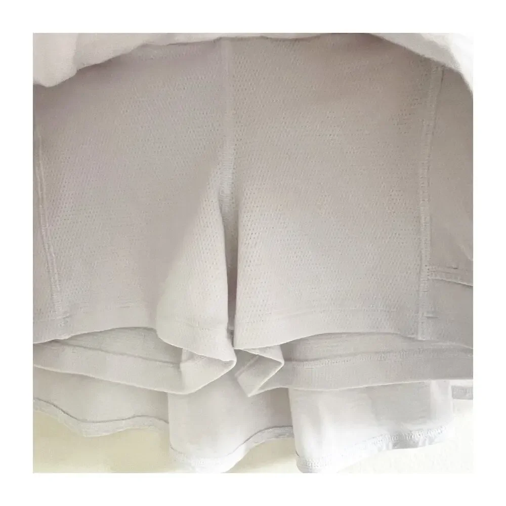 Athleta Serve Skort Girls Size XL White Squiggle Textured Ruffled Sportswear